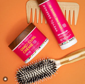Kreyòl Essence OMG curl defining and moisturizing cream in 8oz jar, styling product for curl care and hydration.
