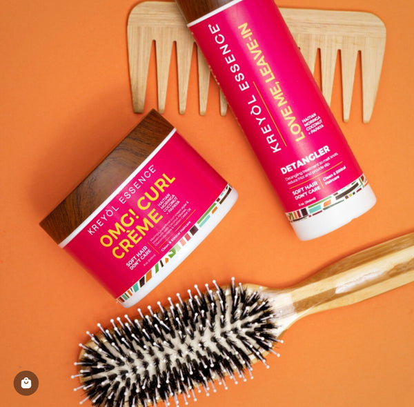 Kreyòl Essence OMG curl defining and moisturizing cream in 8oz jar, styling product for curl care and hydration.