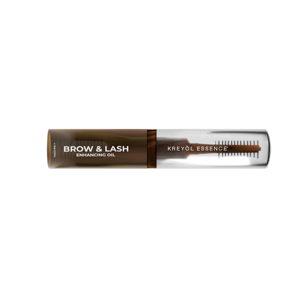 Kreyòl Essence Be Full Brow and Lash Enhancing Serum in a small glass bottle with applicator brush for hair treatment.