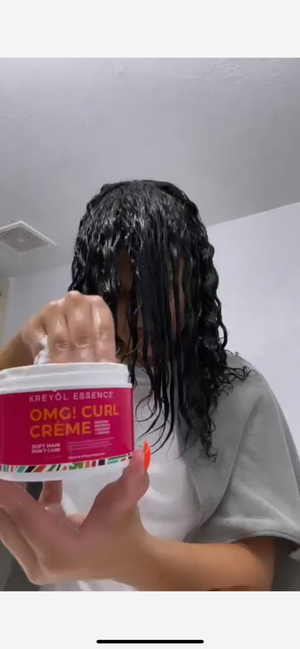 Kreyòl Essence OMG Curl Defining & Moisturizing Cream jar showing product label and 8oz size for styling and curl care.