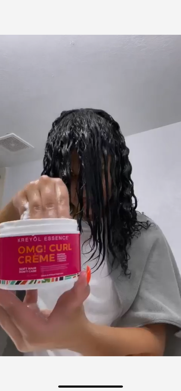 Kreyòl Essence OMG Curl Defining & Moisturizing Cream jar showing product label and 8oz size for styling and curl care.