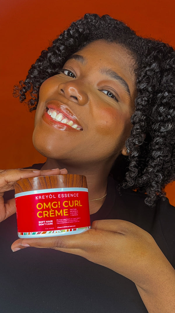Kreyòl Essence OMG Curl Defining & Moisturizing Cream 8oz styling product jar with label and vibrant design.