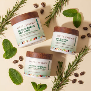 Kreyòl Essence deep conditioning hair care trio in gift set with three bottles of nourishing hair treatments.