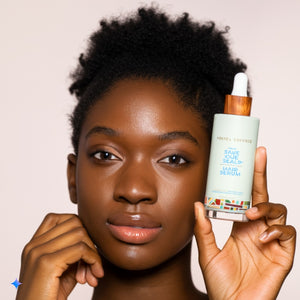 Kreyol Essence Save Our Scalp S.O.S Daily Hair Serum applied to scalp and hair, promoting scalp and hair health.