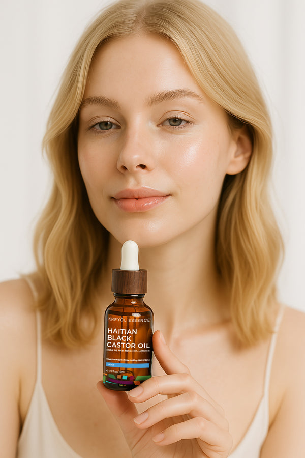 Kreyòl Essence Haitian Black Castor Oil Light for skin and hair, 2oz, in a small bottle, ideal for daily hair and skin treatment.