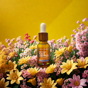 Kreyòl Essence Haitian Black Castor Oil Light 2oz bottle for skin and hair treatment, shown in a yellow-topped container.