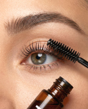Close-up of Kreyòl Essence Brow and Lash "Be Full" Enhancing Serum being applied to eyelashes and eyebrows.
