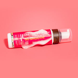 Kreyòl Essence So Smooth anti-frizz styling mousse in an 8oz bottle, with a smooth hair mousse and moringa extract label.