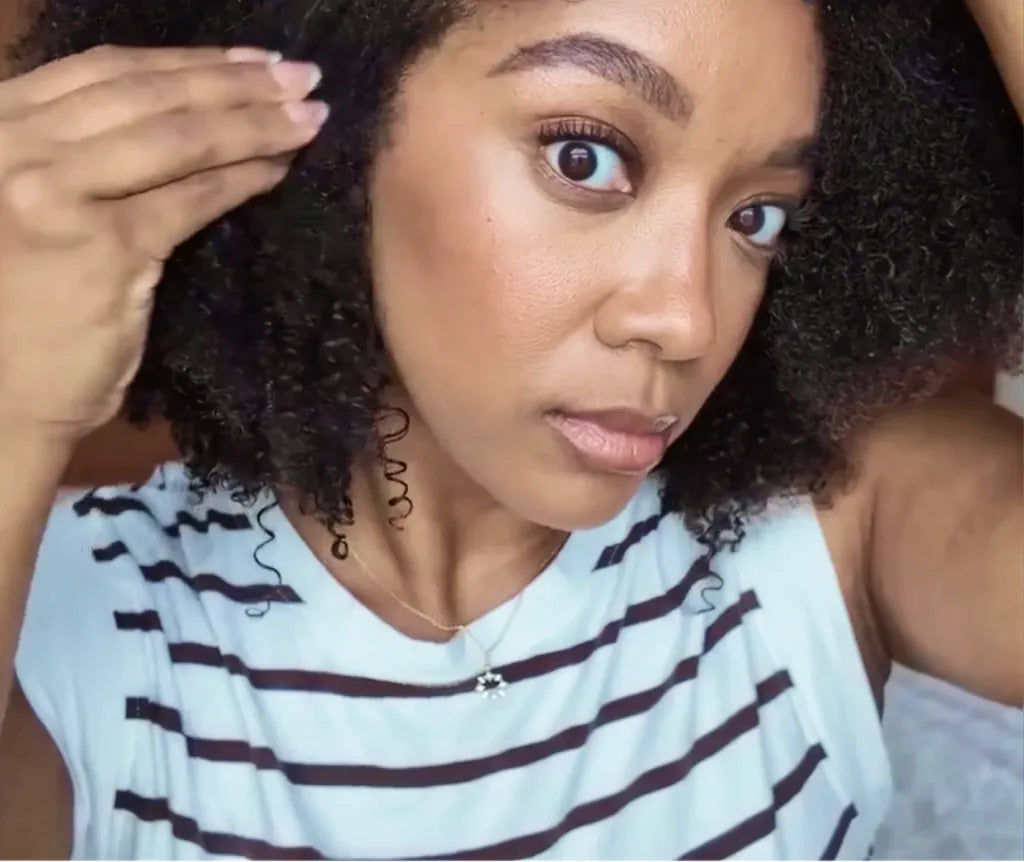 Customer applying the density tonic along her hairline