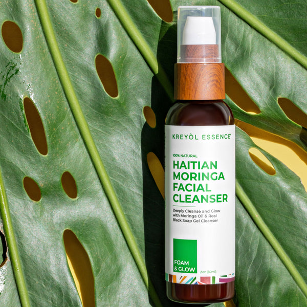 Kreyol Essence Haitian Moringa Duo with 15ml Moringa Oil and 2oz facial cleansing jelly, close-up of the cleanser showing texture.