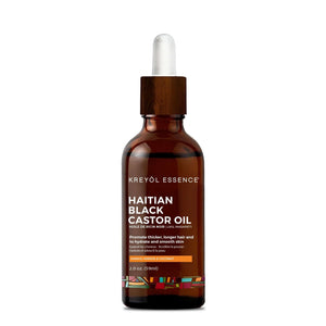 Haitian Black Castor Oil by Kreyòl Essence in 2oz bottle with mango, papaya, and coconut for hair and skin care.