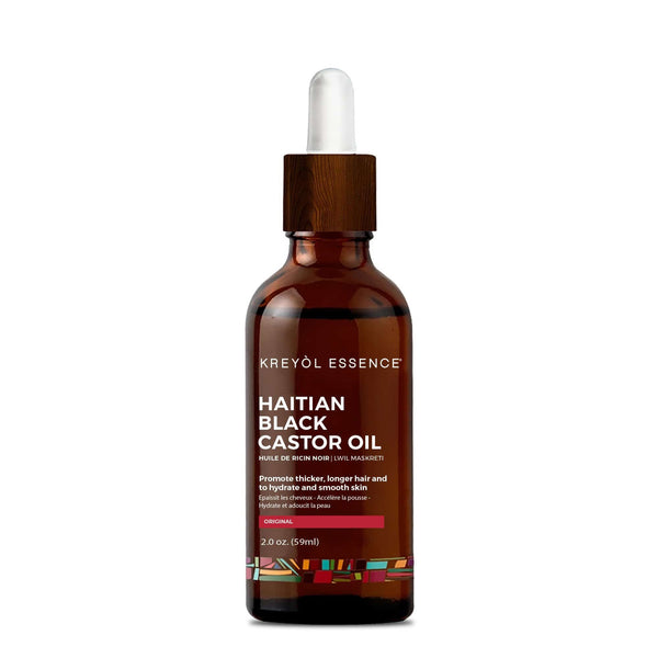 Haitian Black Castor Oil bottle from Kreyòl Essence, 2oz, with black castor oil visible inside the clear glass container.