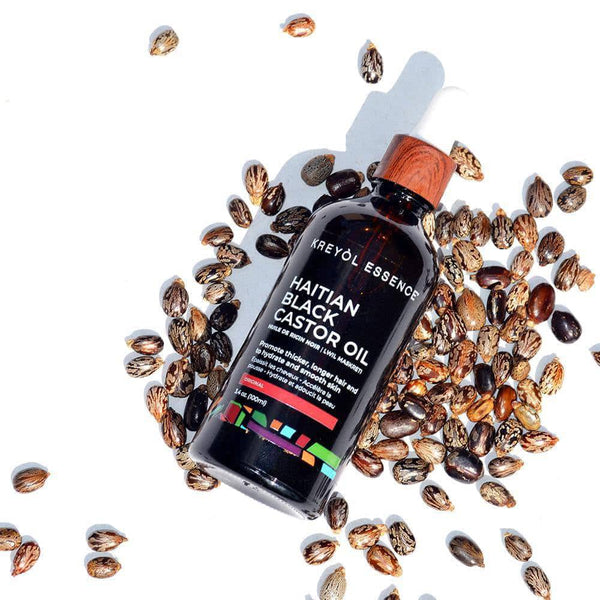 Haitian Black Castor Oil by Kreyòl Essence in a 2oz bottle, natural Haitian black castor oil for hair and skin care.