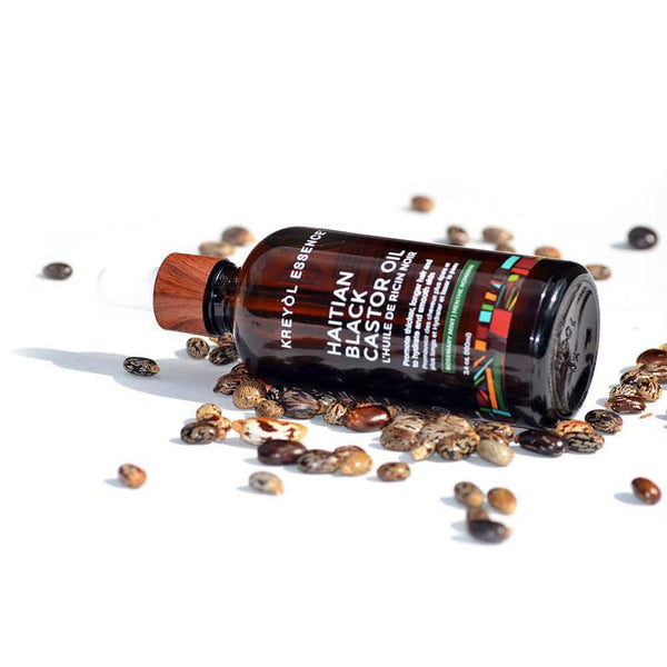 Haitian Black Castor Oil by Kreyòl Essence with rosemary and peppermint, 3-4oz super size bottle for hair and scalp care.