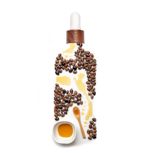 Haitian Black Castor Oil bottle from Kreyòl Essence with natural ingredients, dark glass bottle, and product label visible.