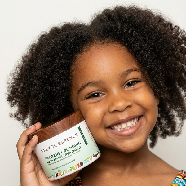 Kreyòl Essence Haitian Hair Cocktail Triple Threat Mask Trio gift set with three black containers and colorful labels for hair care.