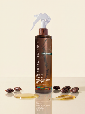 Kreyòl Essence Let it Grow scalp and hair strengthening treatment spray bottle with spray nozzle, close-up of product label.
