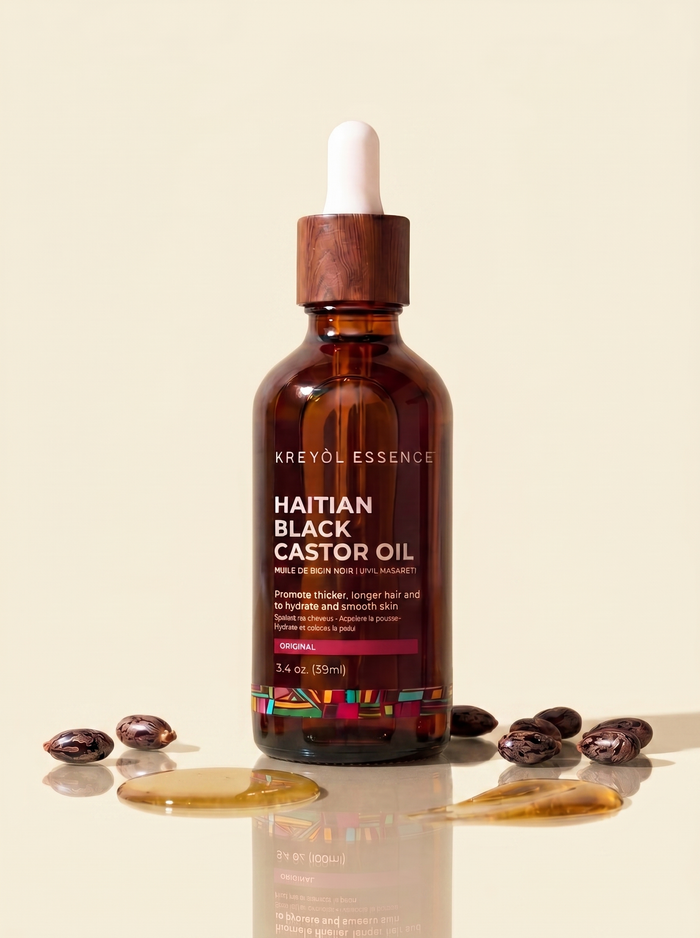 Haitian Black Castor Oil bottle by Kreyòl Essence, 2oz, original unscented scalp oil in a clear glass bottle with black cap