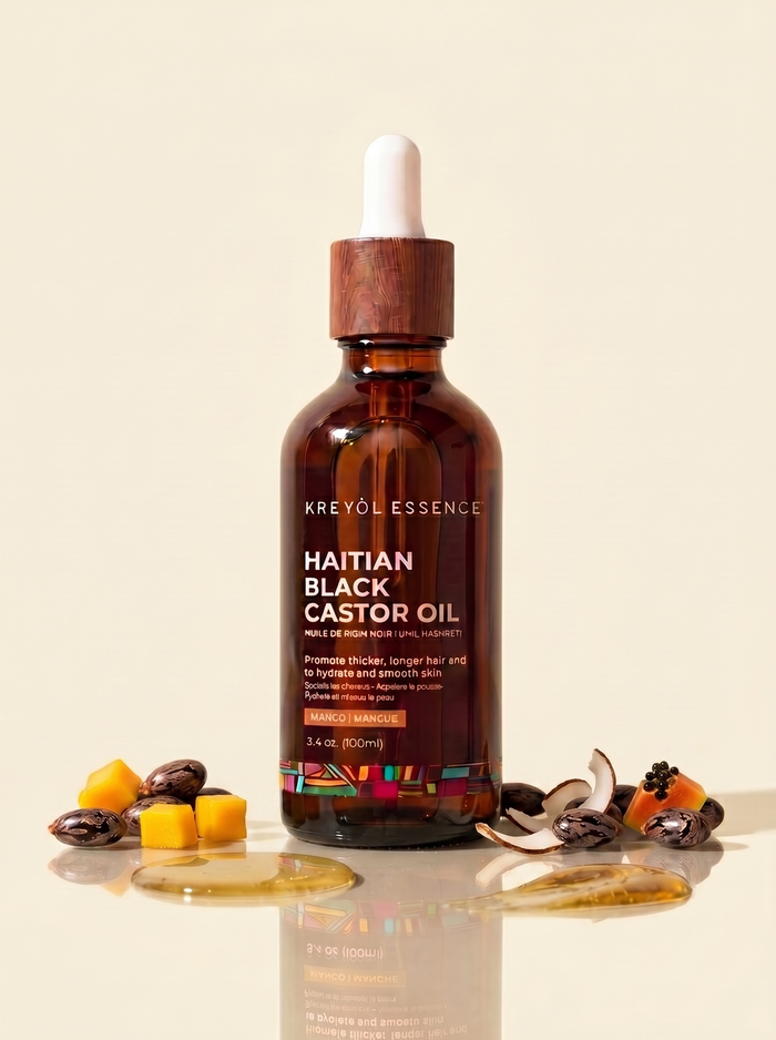 Haitian Black Castor Oil by Kreyòl Essence in 3.4oz super size bottle, with mango, papaya, and coconut ingredients.