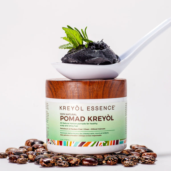 Close-up of Kreyòl Essence Stella Jean Haitian Heritage Hair Duo in a gift set with pomade and hair care products.