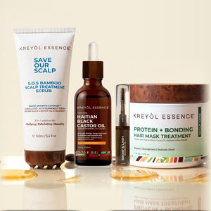 Kreyòl Essence Rebuild Set bundle with natural products for skin repair, displayed in various bottles and containers.