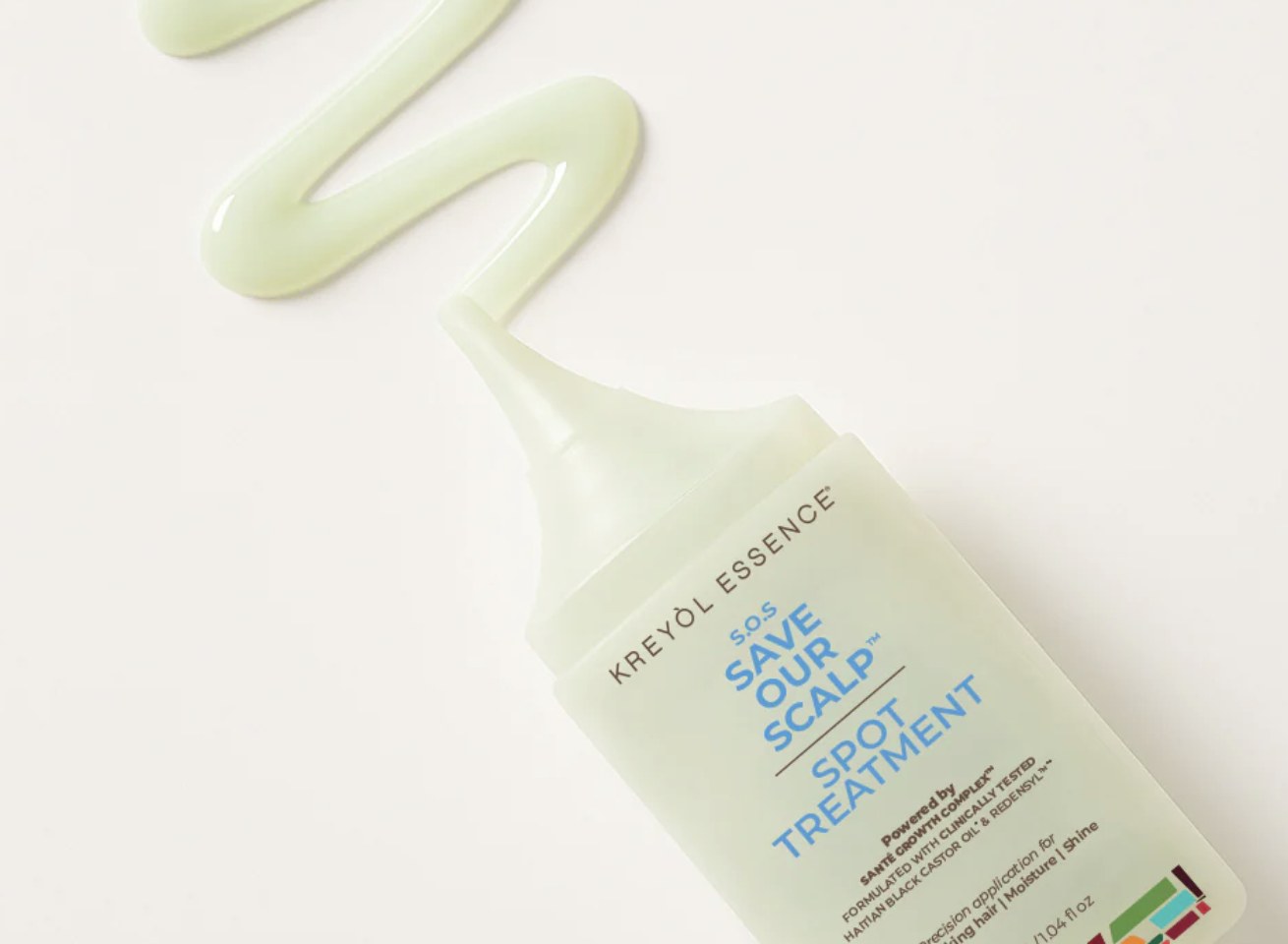 S.O.S Spot Treatment squeeze bottle with a ribbon of serum